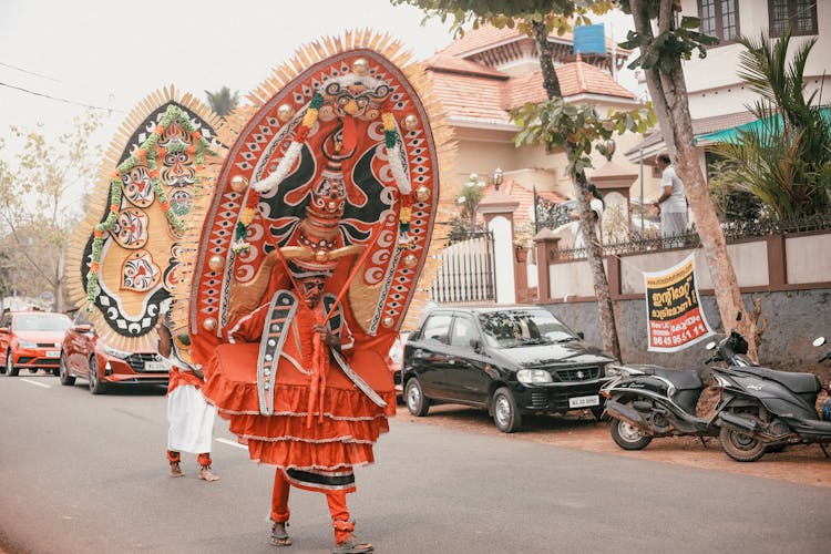 People On Costumes On Street In Town