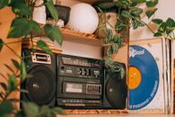Black Radio on Brown Wooden Shelf