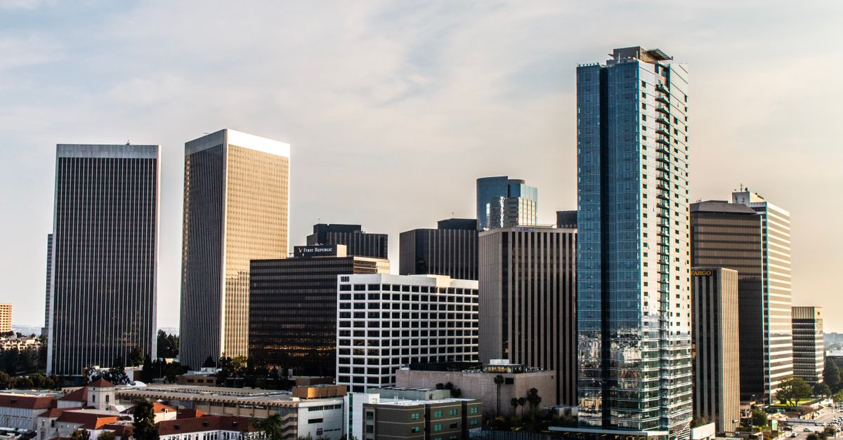 A modern cityscape of Beverly Hills featuring towering skyscrapers and contemporary architecture.