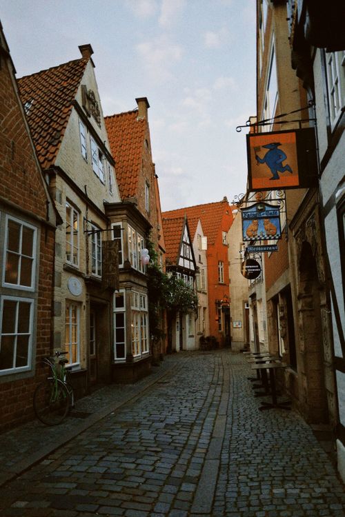 Free Narrow cobblestone street in Bremen's old town with traditional architecture. Stock Photo