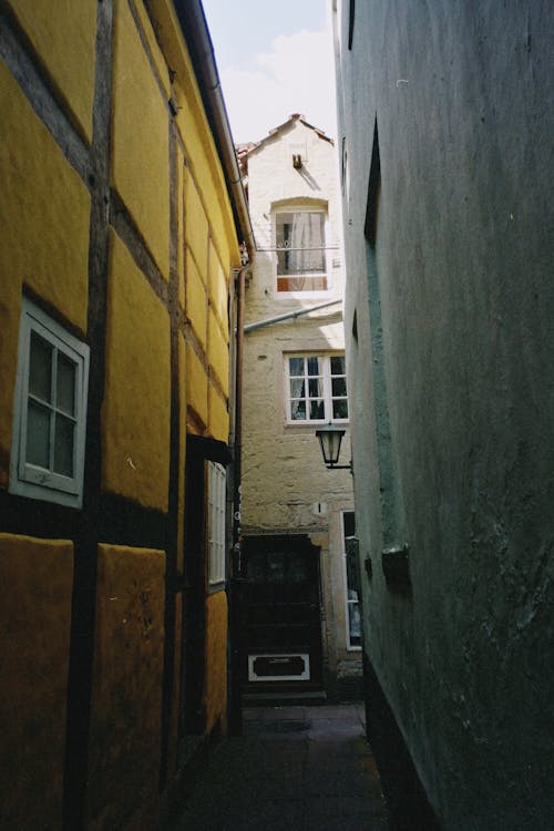 Narrow Alleyway Between Concrete Walls