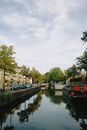 Red Boat on River Near Green Trees