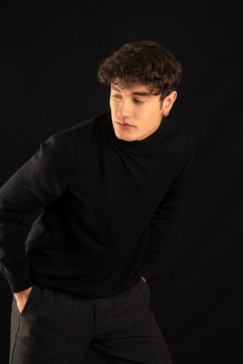 Free A Man In Black Sweater and Pants Stock Photo