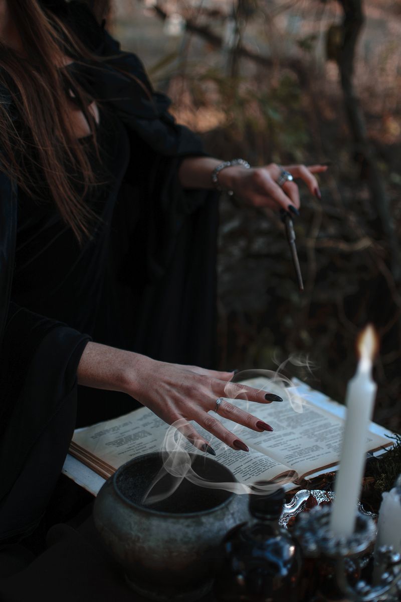 Witch altar with candles, crystals and herbs