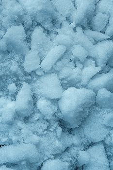 Detailed close-up of snow texture, emphasizing the unique structure of snowflakes.