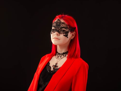 Close-Up Shot of a Woman Wearing a Masquerade Mask