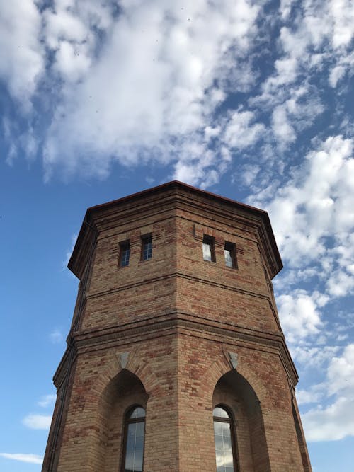 Brown Brick Building Under the Sky