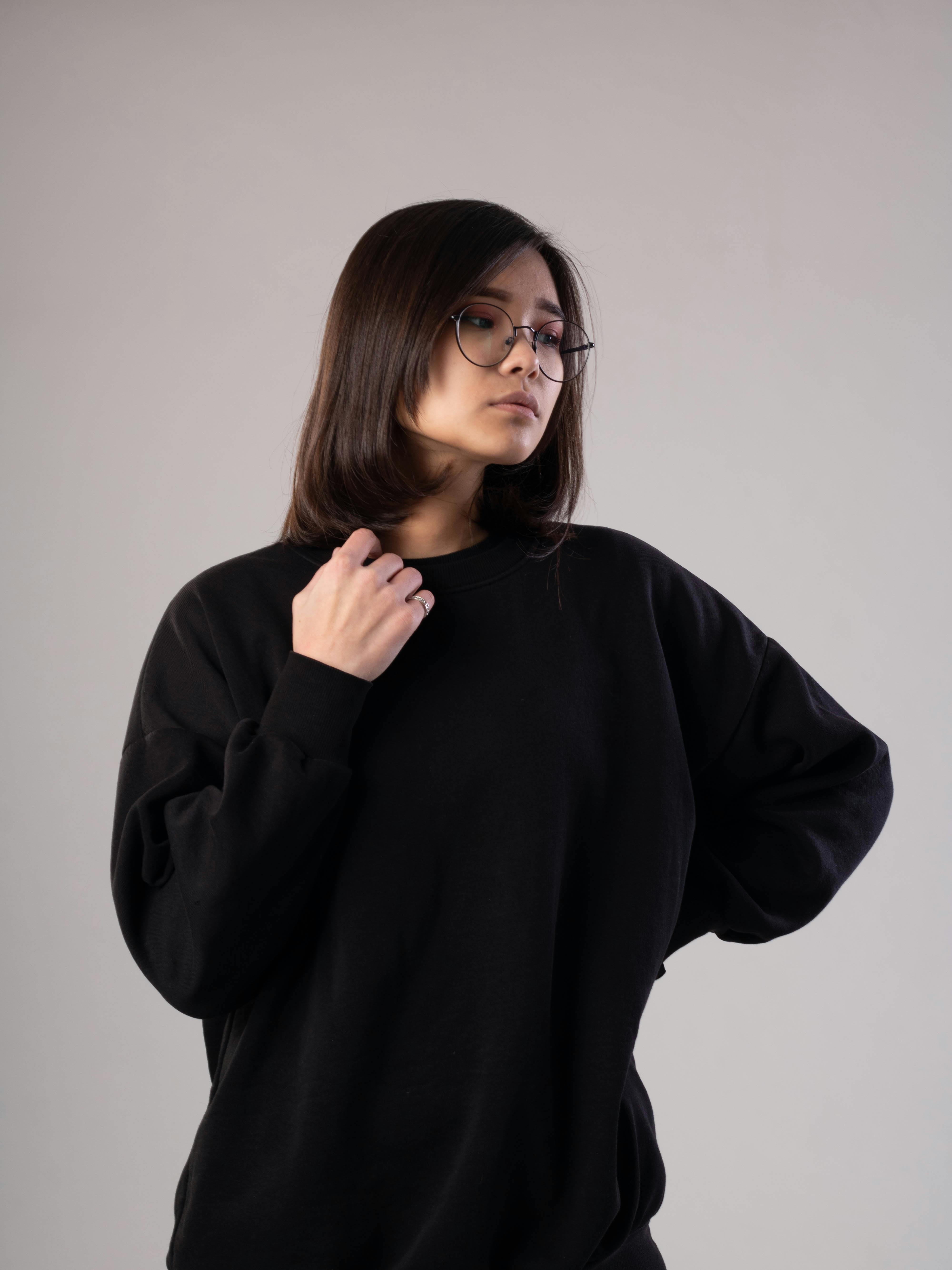 Girl in Black Sweater Wearing Eyeglasses · Free Stock Photo