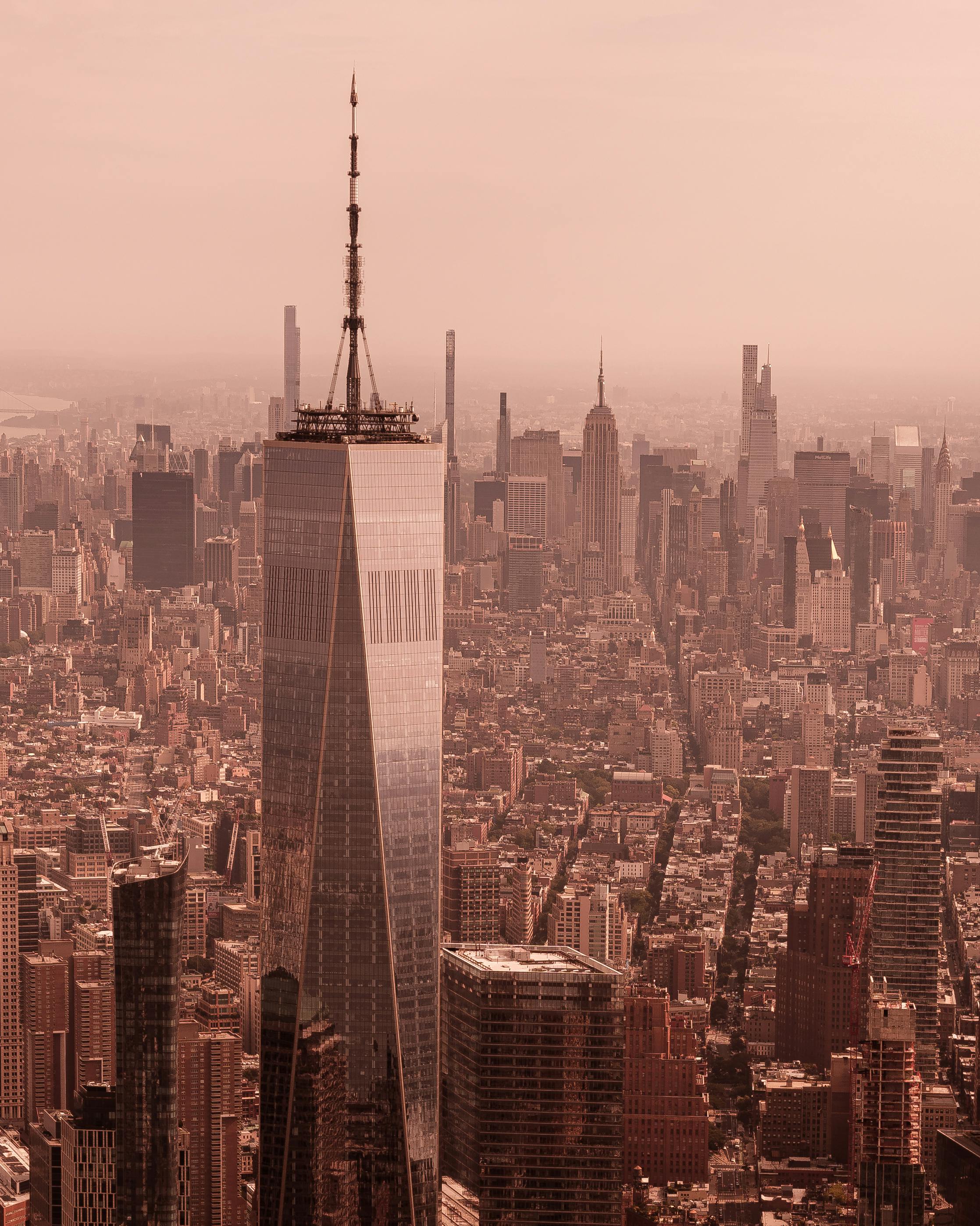 A stunning aerial view of New York City featuring the iconic One World Trade Center.
