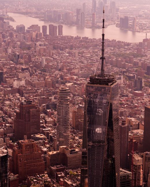 A stunning aerial shot of One World Trade Center overlooking New York City's skyline.