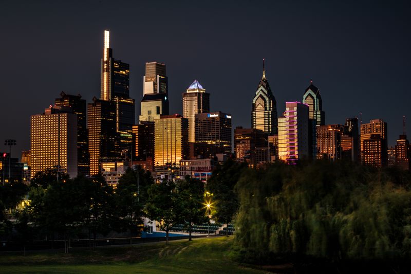 Philadelphia skyline illuminated at night viewed from the park