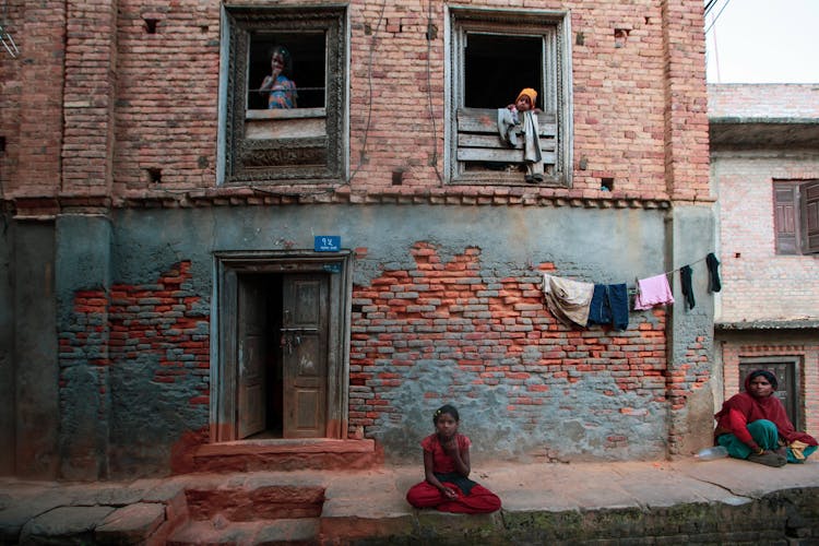 Woman And Kids On Street And House