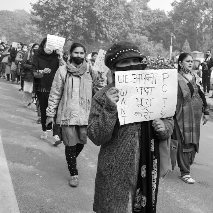 Women Holding Signs During A Protest