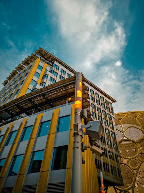 Low-Angle Shot of a High Rise Building under the Cloudy Blue Sky