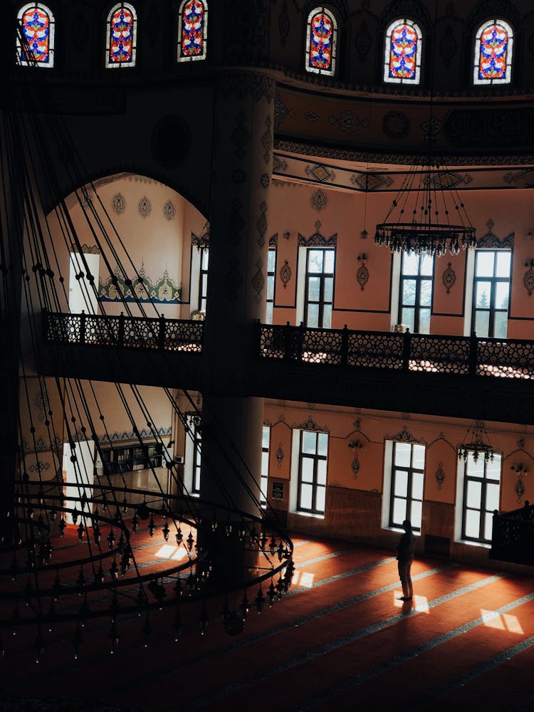 Intricate Metal Railings And Chandeliers Inside A Building