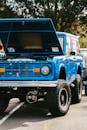 Blue Vehicle Parked near Tree