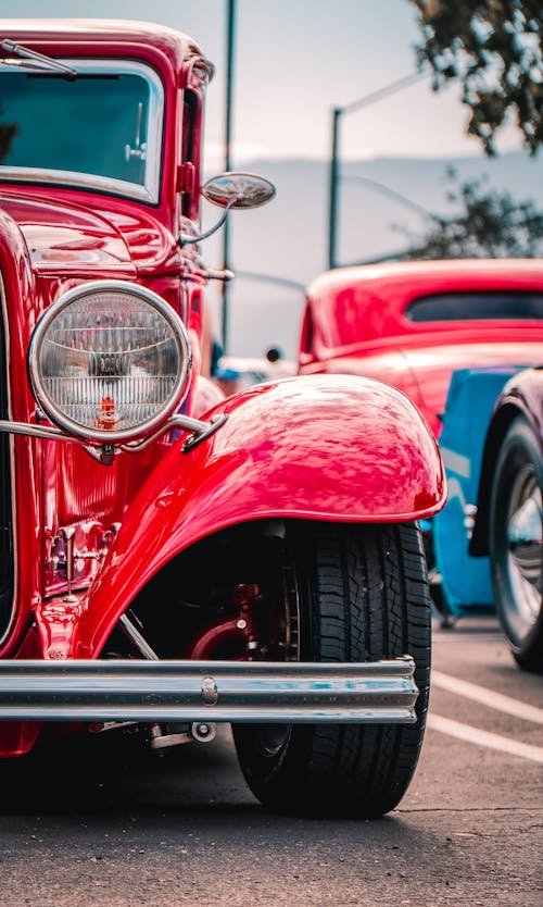 A Red Vintage Car in the Car Show