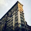 Low Angle Photography of Brown Concrete Building Under Blue Sky