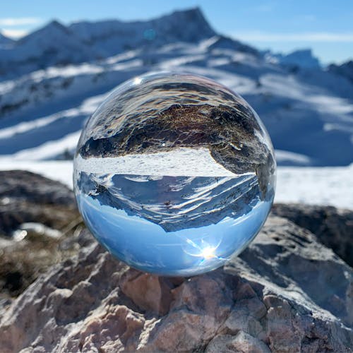 Free Clear Glass Ball on Rocky Mountain Stock Photo