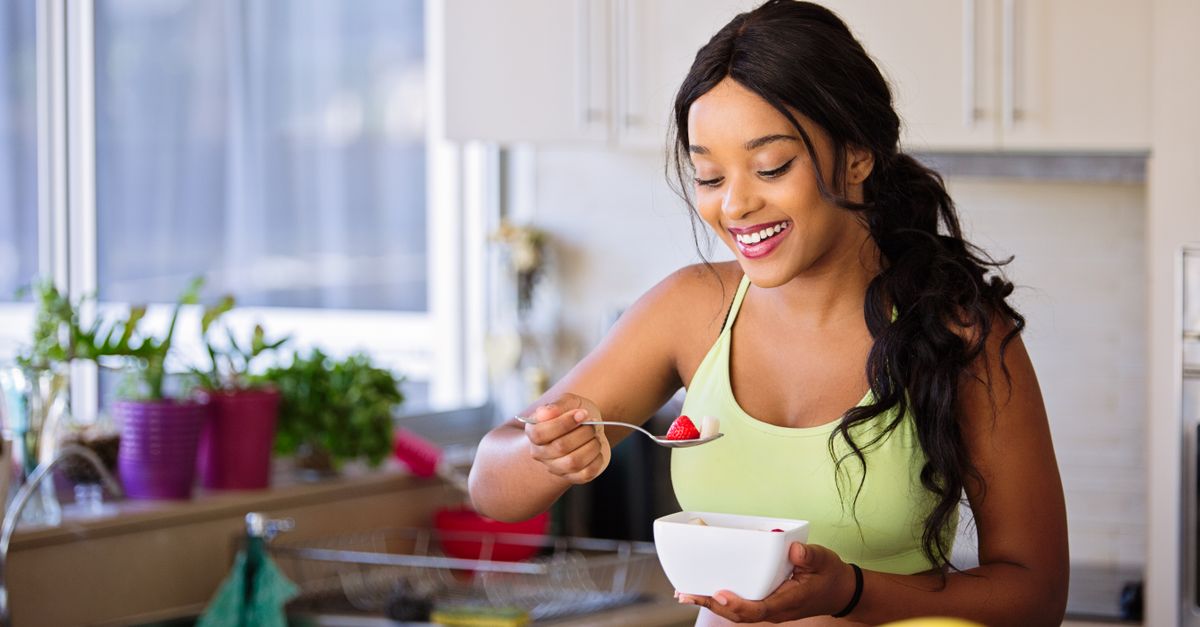 woman journaling morning routine bright window healthy breakfast