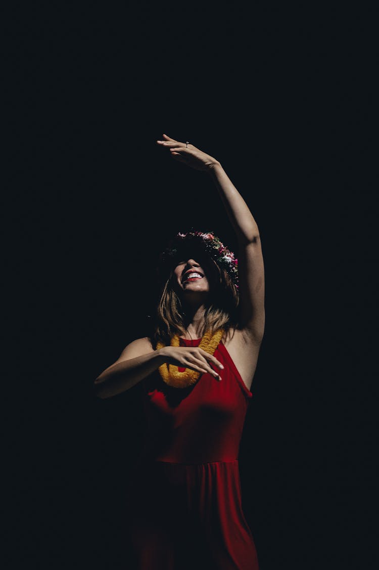 Woman In Red Sleeveless Dress Dancing