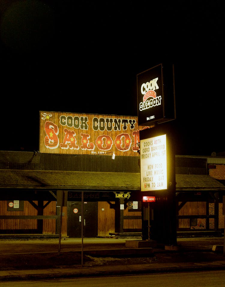 Cook County Saloon Sign At Night