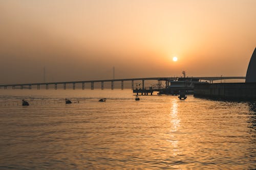 Bridge on Water during Sunset