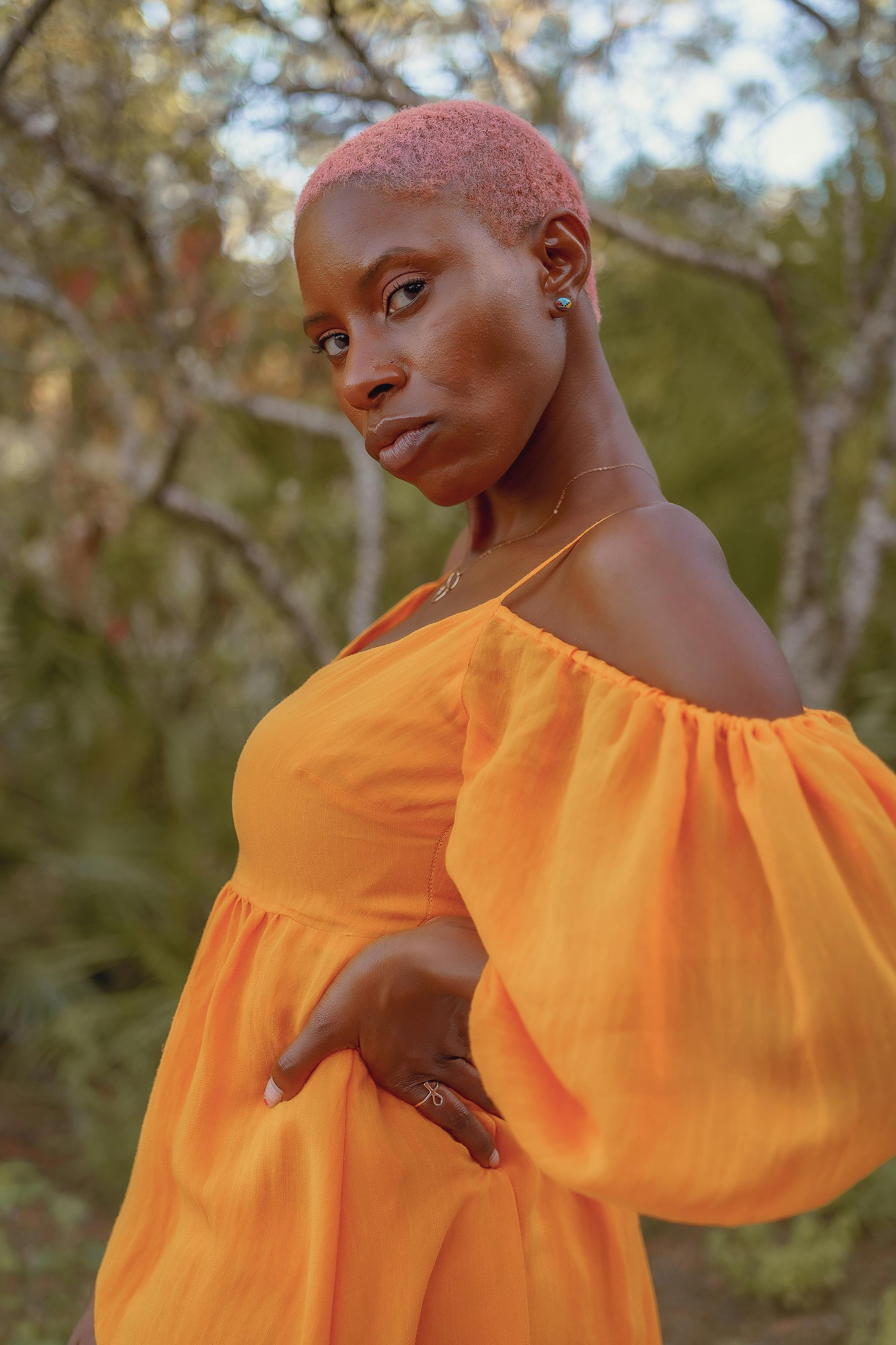 a woman wearing an orange dress