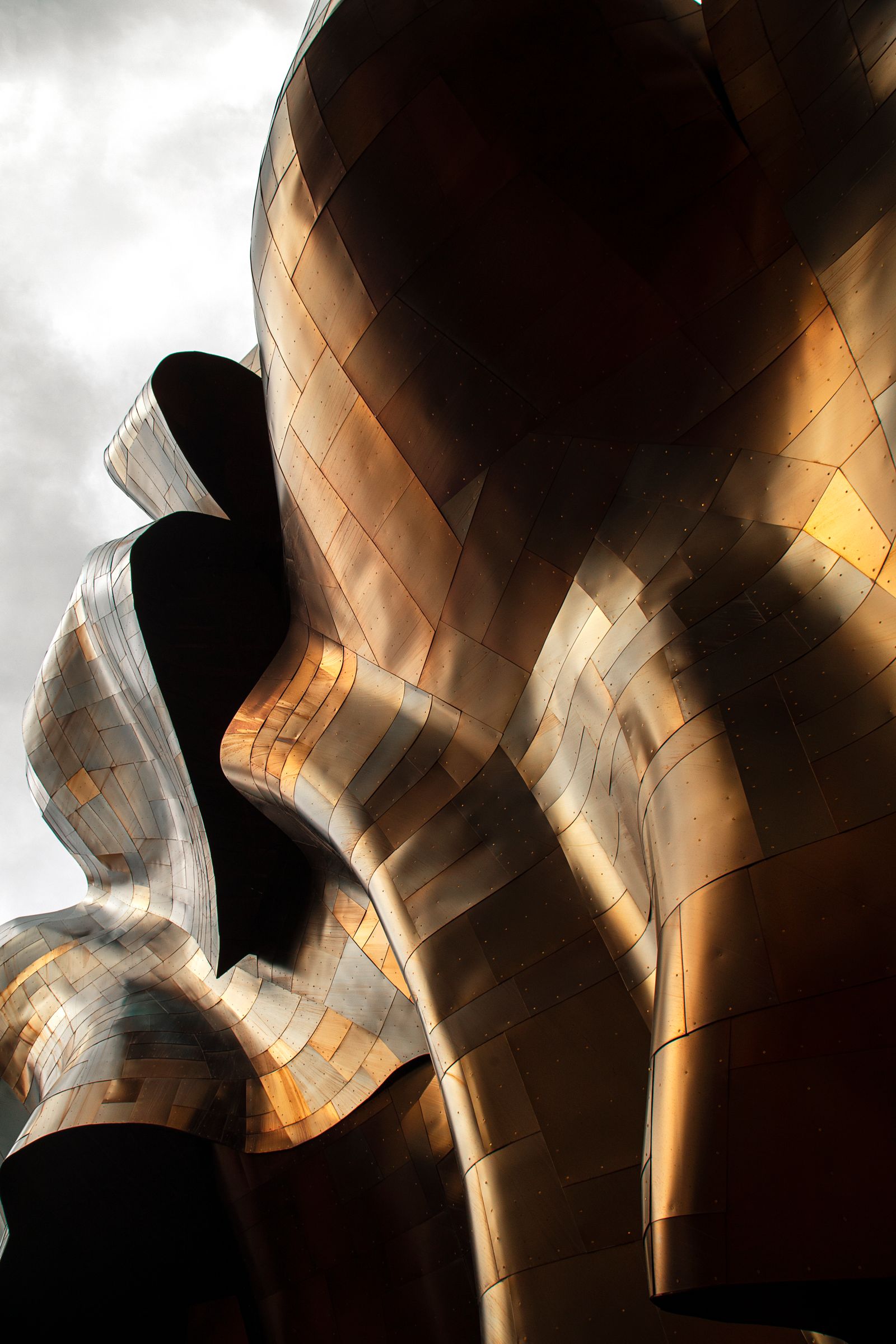 Curved metallic facade catching light — photo by Hussein Haidar Salman on Pexels