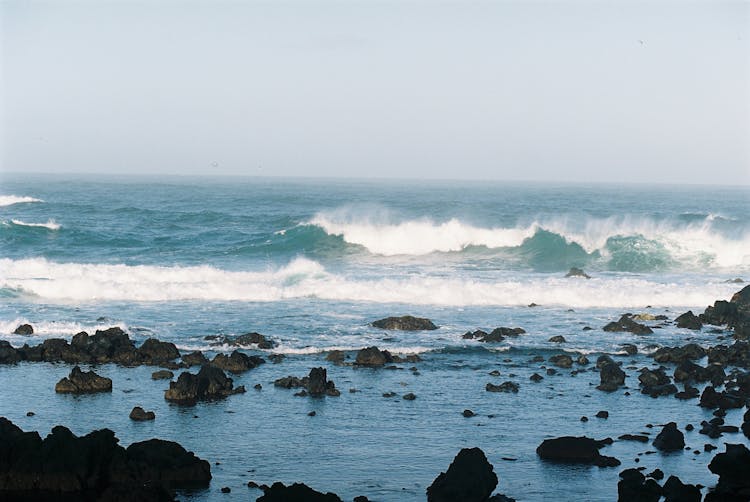 Crashing Waves On Rocky Shore