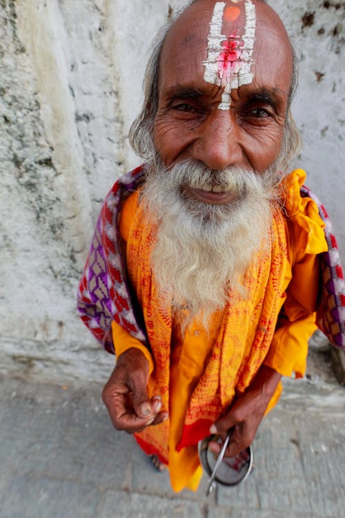 Man in Orange and Yellow Dress