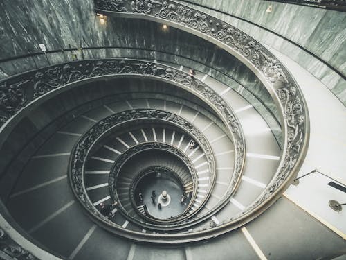 Free People Walking on Spiral Staircase Stock Photo