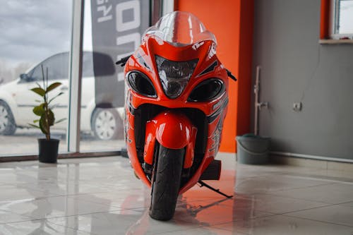 Red Motorbike Parked Inside a Showroom