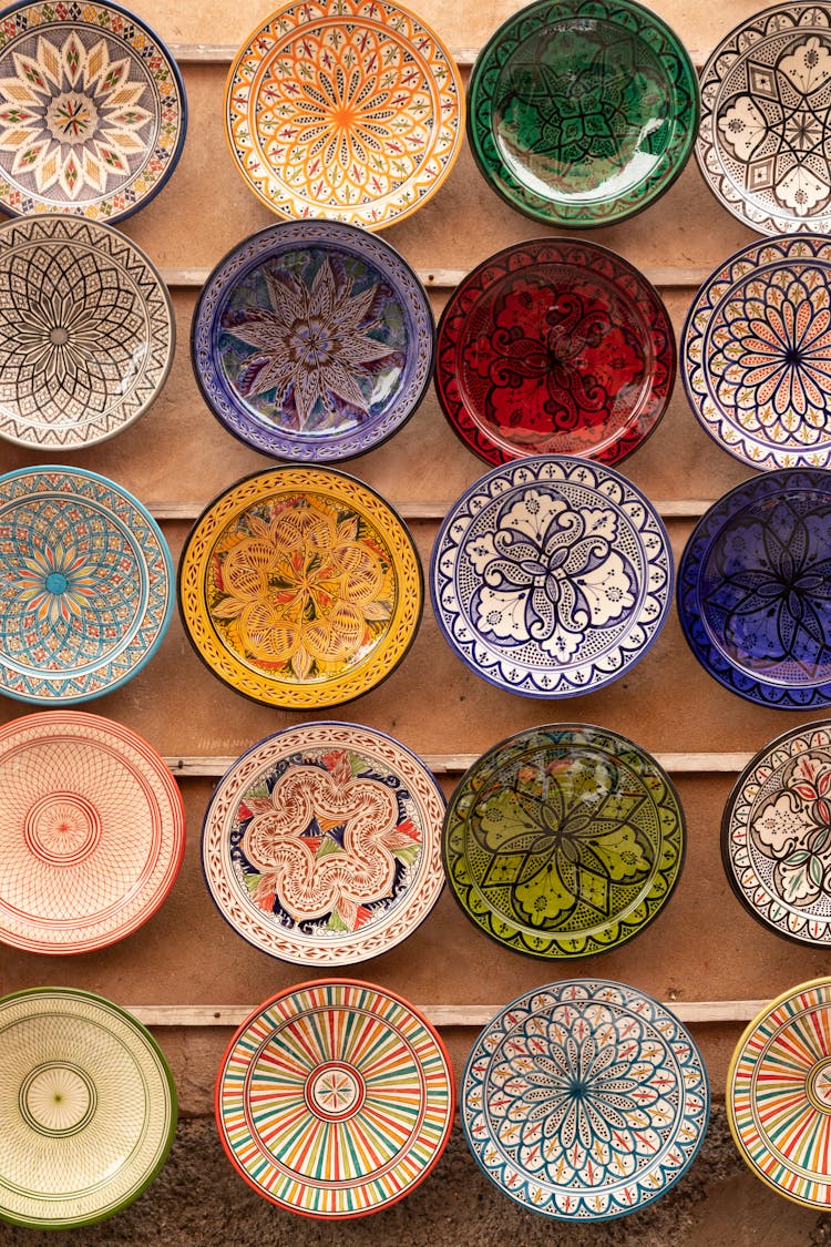 Multicoloured Decorative Plates Hanging On A Wall