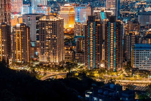 A breathtaking cityscape with illuminated skyscrapers at night, showcasing urban vibrancy and modern architecture.