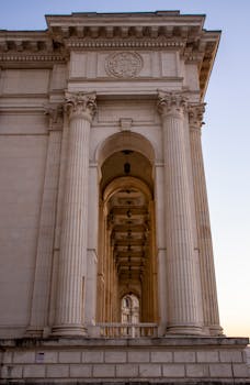 A stunning view of neoclassical columns at sunset in Bucharest, Romania.