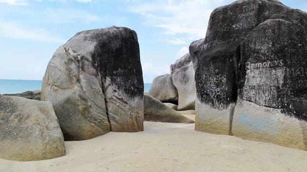 Large granite boulders on a pristine beach in Bangka Belitung Islands, Indonesia.