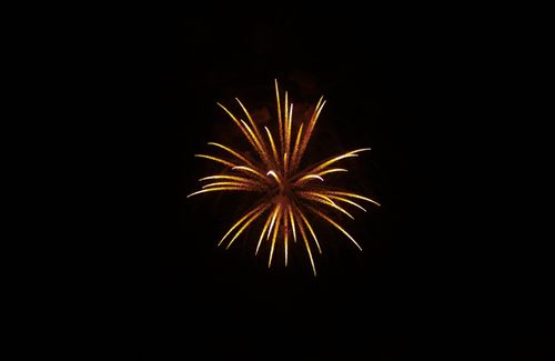 Free A stunning display of fireworks lighting up the night sky with vibrant colors. Stock Photo
