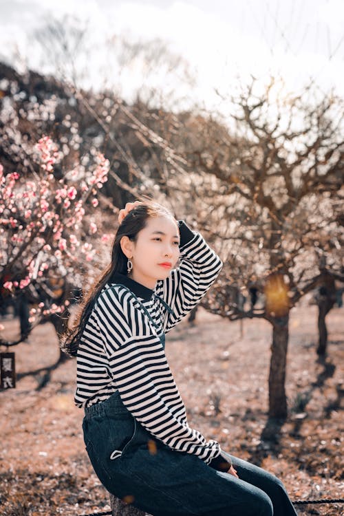 A Woman Wearing Stripes Long Sleeves