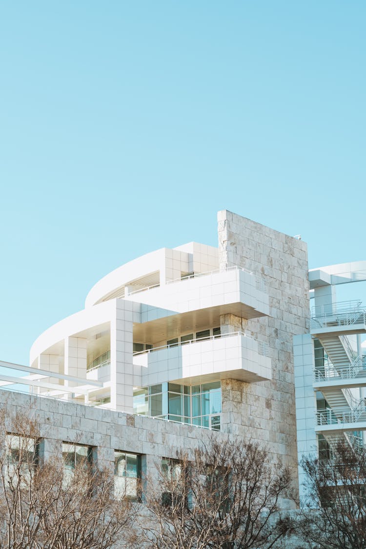 White Concrete Building Under The Blue Sky