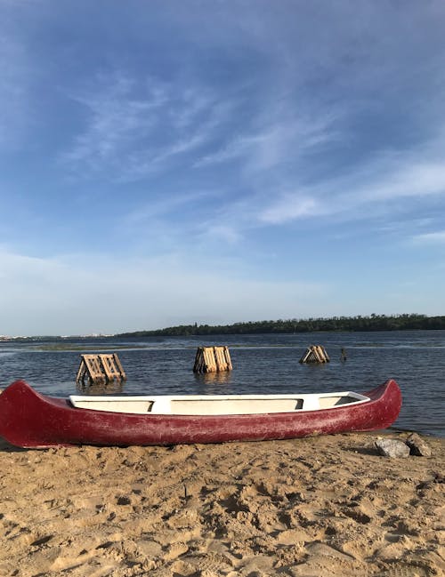 Red and White Boat on the Shore