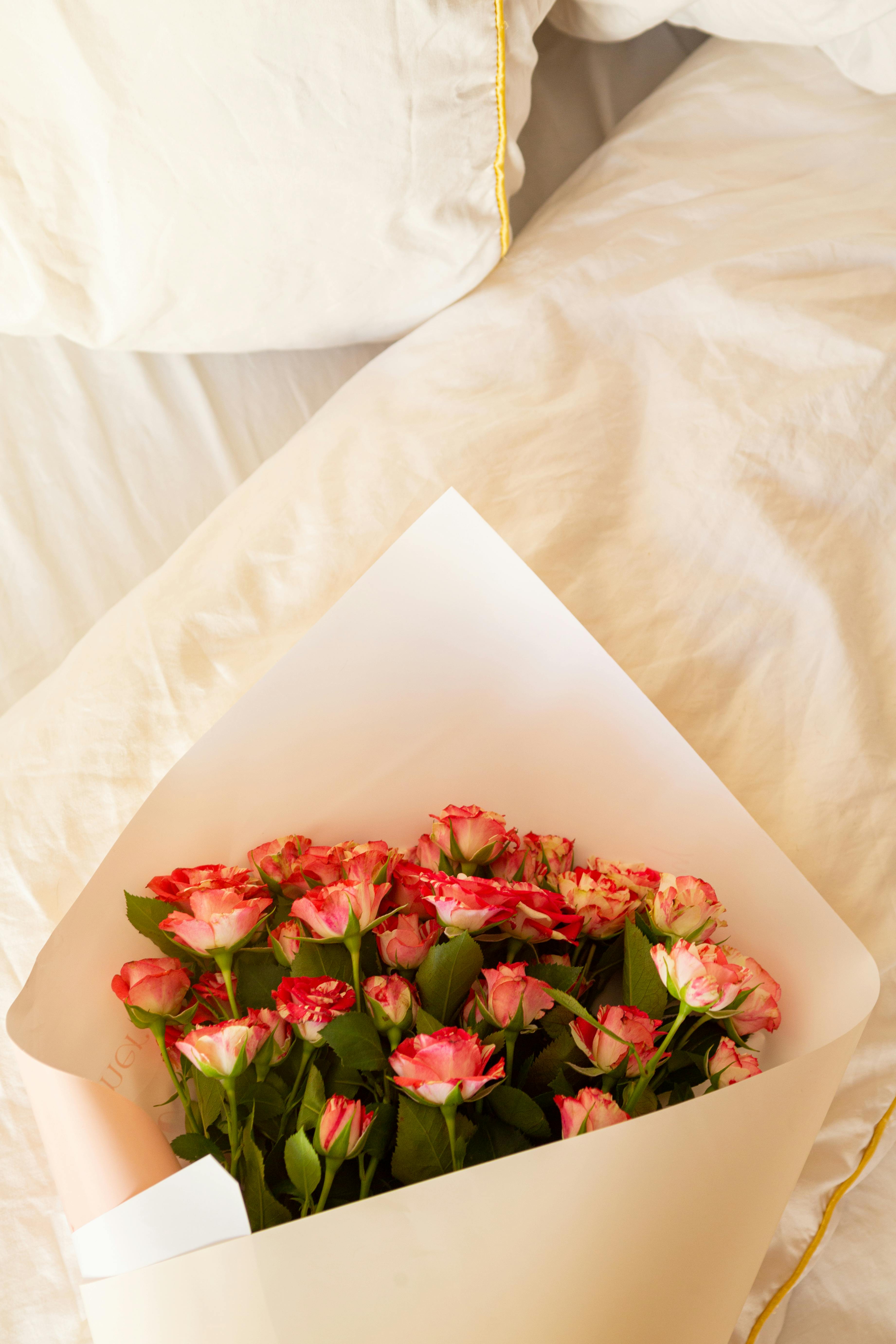 A Bouquet of Flowers on the Bed · Free Stock Photo