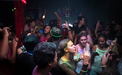 Free Crowd Dances in Blue Painted Enclosure Stock Photo