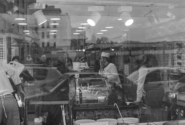 Black And White Photo Of People Inside The Store