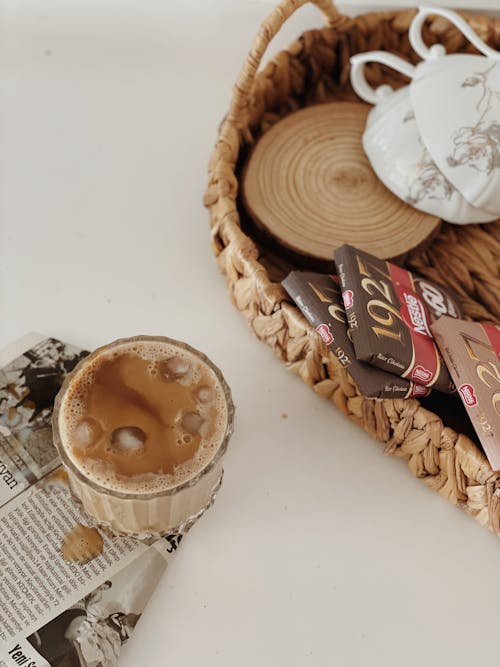 Free Chocolate Bars in Basket Near a Chocolate Drink Stock Photo