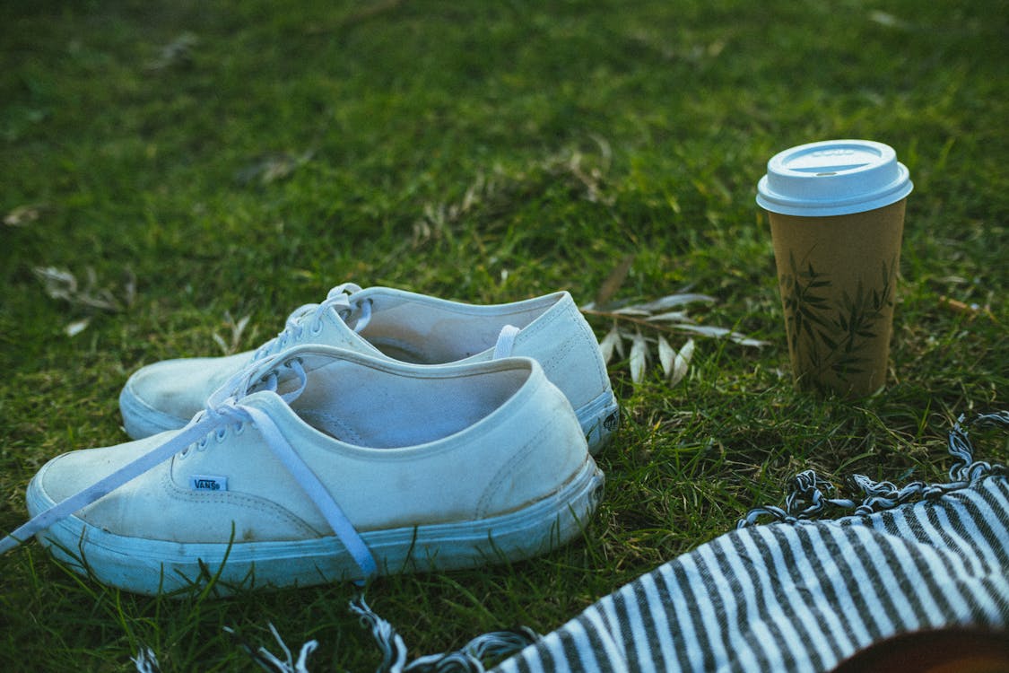 White Shoes on Green Grass