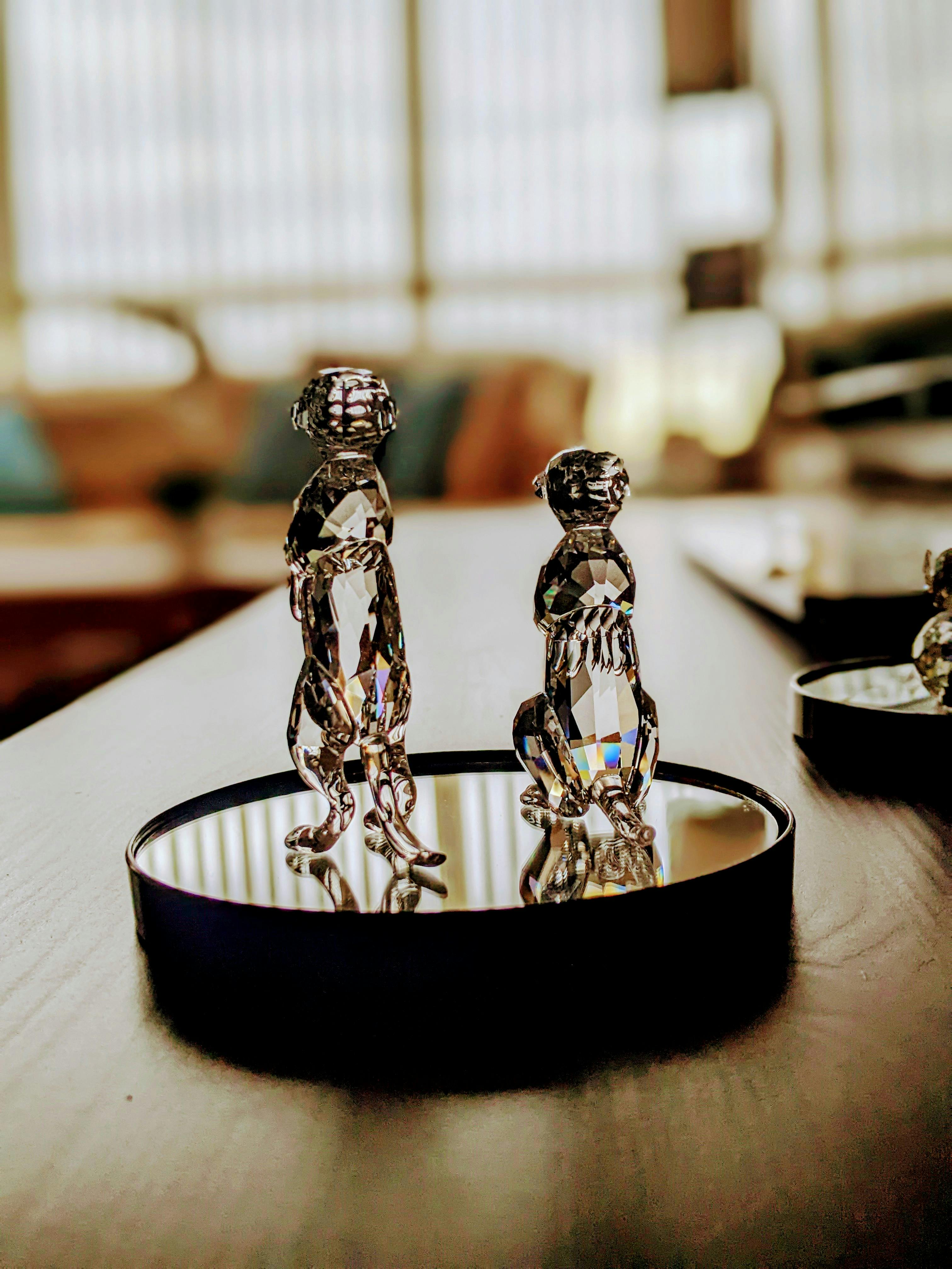 Statue on a Pedestal Near HalfMast Flags · Free Stock Photo