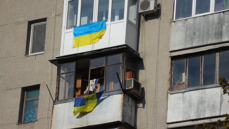 Broken Windows Of A Apartment Building