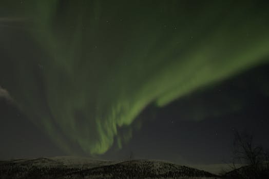 Captivating display of aurora borealis illuminating the night sky in Utsjoki, Finland.