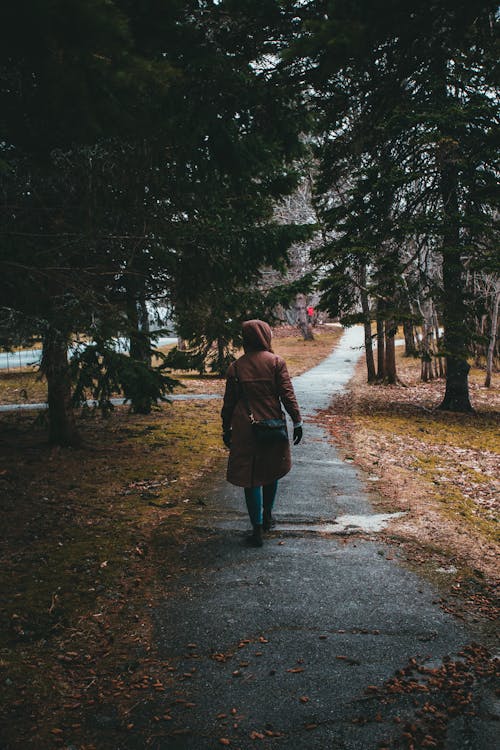 A Woman Walking on the Park